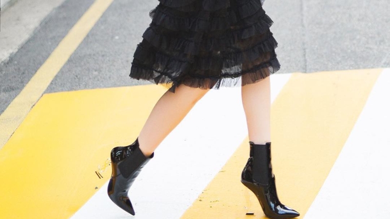 Boots combined with flared skirt for a stylish and trendy style