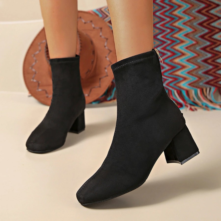 Pair pinafore dress with ankle boots