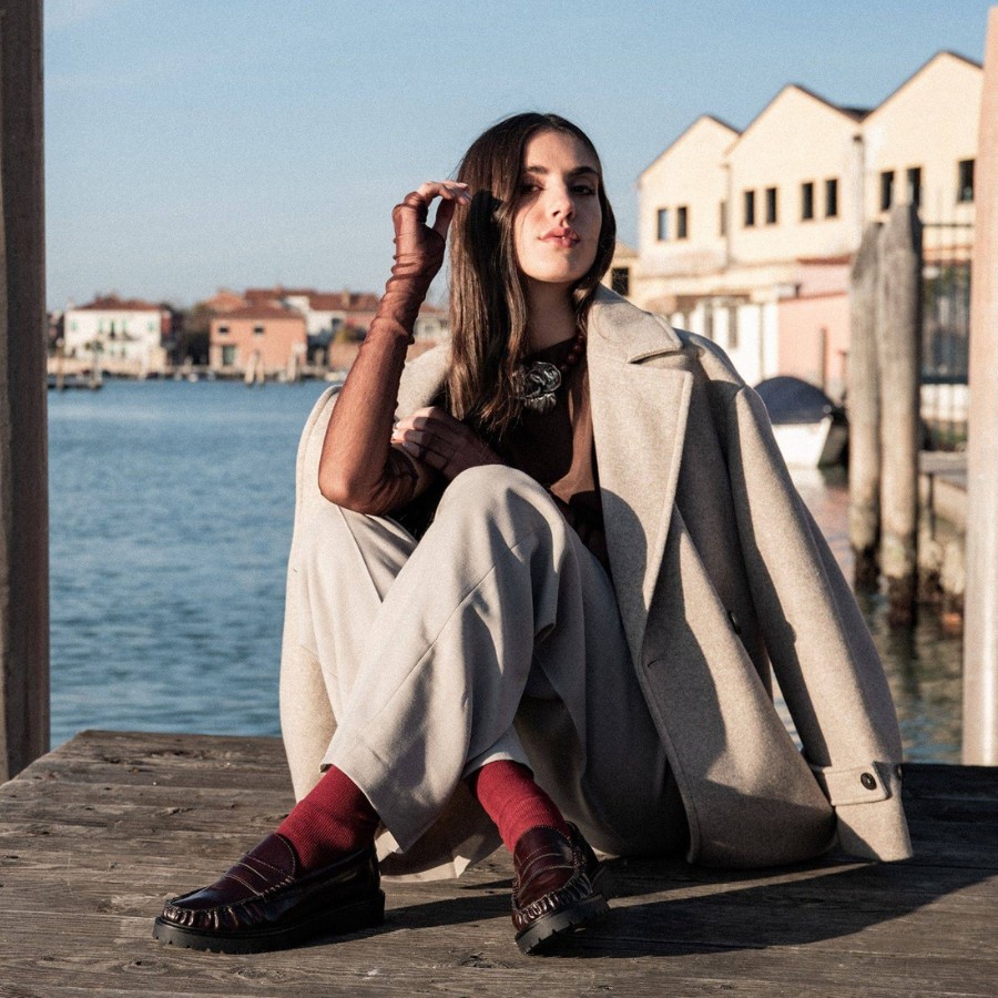 Match pinafore dress with loafers