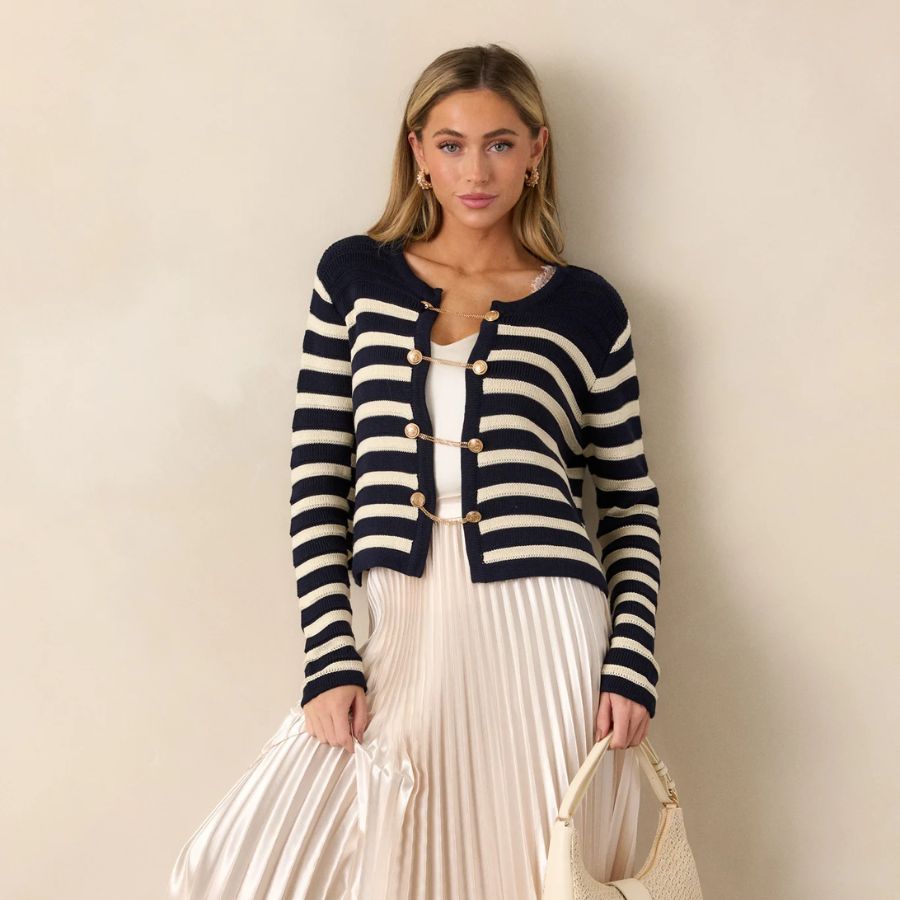 Wear a long flared skirt with a cardigan